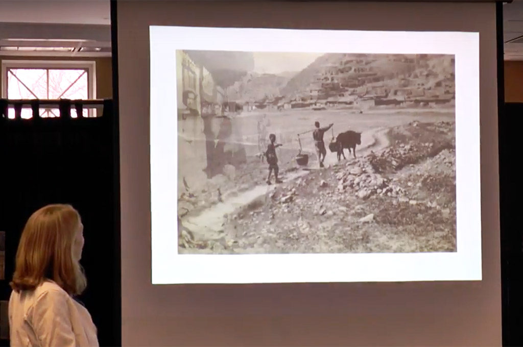 Slide: People & oxen on hill